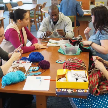 Group of people knitting together