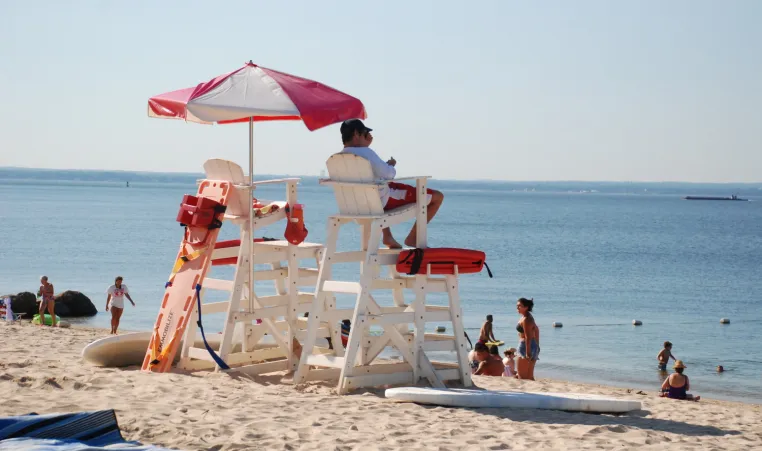 Lifeguard scanning the beach ensuring patron safety 