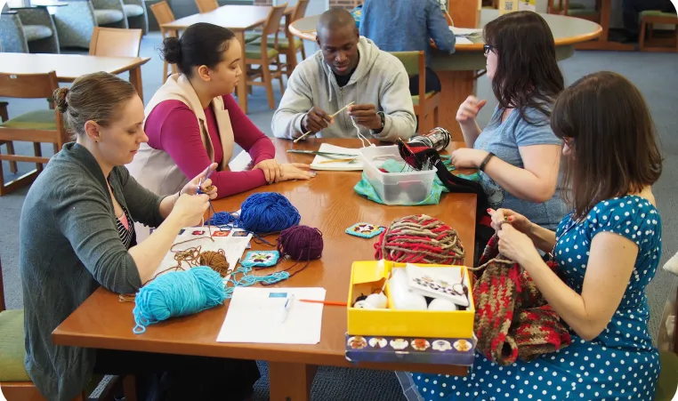 Group of people knitting together