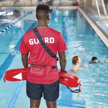 A lifeguard watches the pool at the Y.